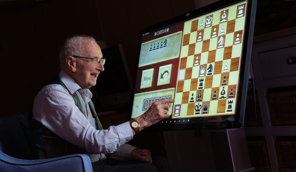 Resident using interactive technologies at Connaught Court
