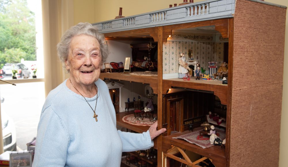 Resident with doll house at Zetland Court