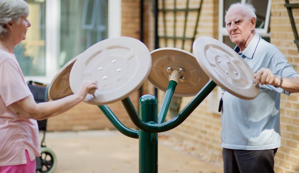 Residents using the outdoor gym at Prince Michael of Kent Court