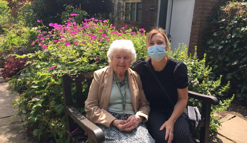Resident Jill Holbrook enjoys the outdoors with Tracy Lydon, one of the Home’s Activities Coordinators.