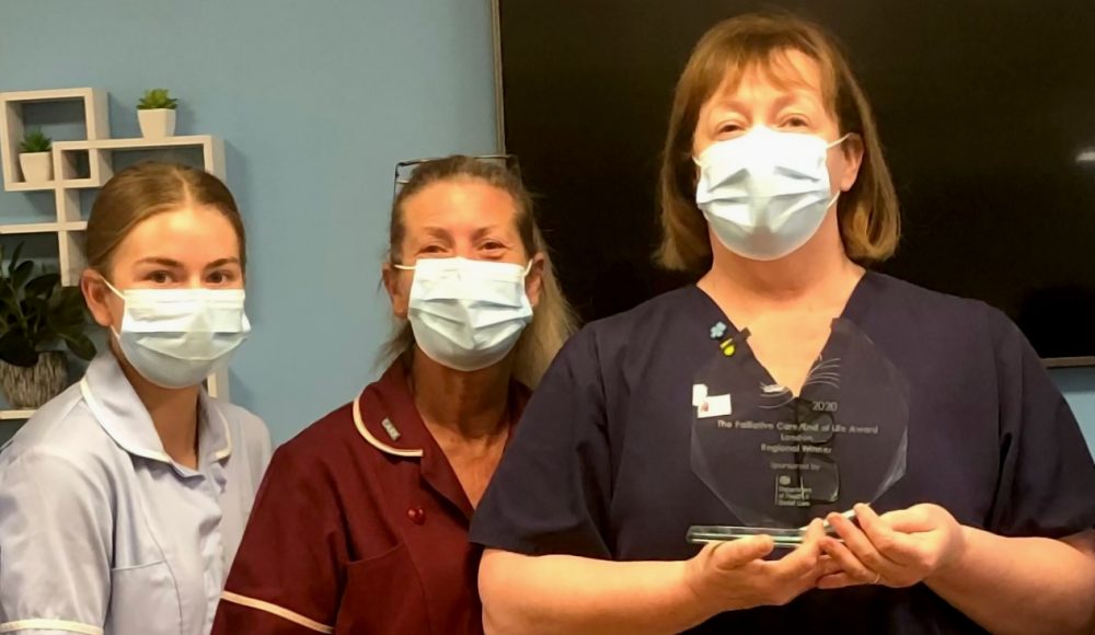 Clinical Lead Kim Fletcher holds her award while celebrating with staff members Pauleen Wickes and Amber Tarleton at Prince George Duke of Kent Court.