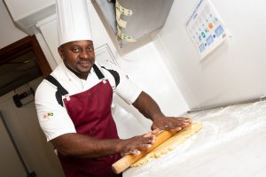 Chef Manager Stowell Barry rolls the dough to prepare one of his delicious meals at RMBI Home Zetland Court.  