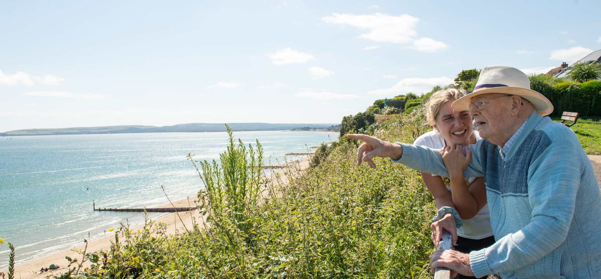 Activities Coordinator Sophie Smith and resident Ron Jones from Zetland Court looking at the beach in Bournemouth.